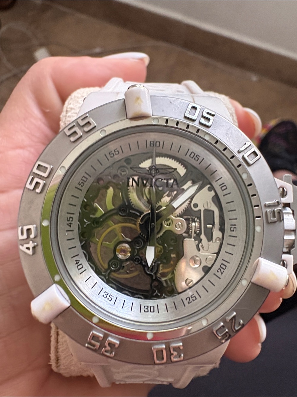 Invicta Women’s White and Silver Skeleton Dial Sport Watch